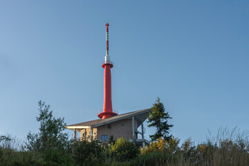 Obraz premium Television transmitter on Lysa Hora, Beskid mountains, Czech republic at summer sunset time.