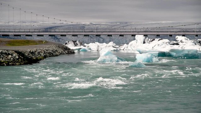 Jokulsarlon lagoon, Iceland. Icebergs flowing under the bridge in summer season