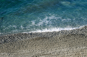 Clear sea with pebble beach