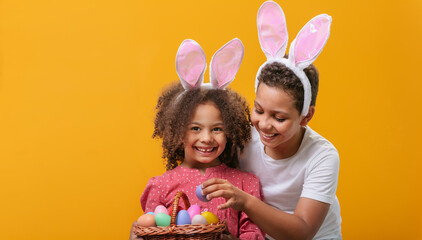 Children with a basket full of eggs are getting ready to celebrate the Easter holiday
