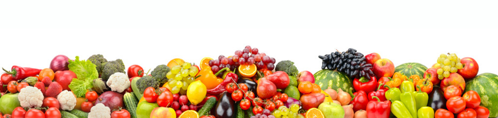 Multicolored berries, fruits and vegetables isolated on white