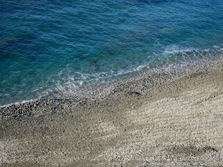Clear sea with pebble beach