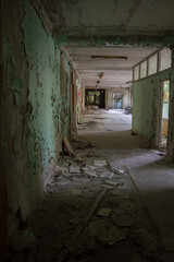 Fototapeta na wymiar School premises in the city of Pripyat in Ukraine. Emptiness. Dampness. Exclusion Zone. Chernobyl zone