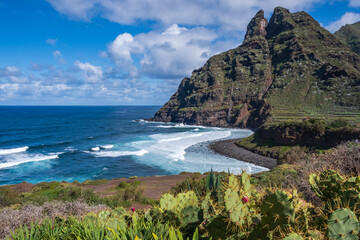 The rugged coastline of  Punta del Hidalgo. with the Anaga Mountains in the background,  Tenerife, Canary Islands © Jim