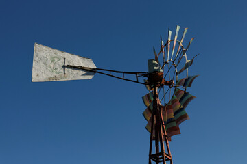 old windmill on sky background