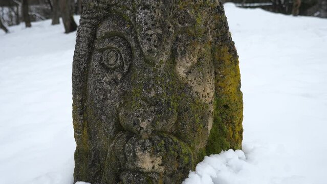 Antique Slavic idol in Ukraine in winter
