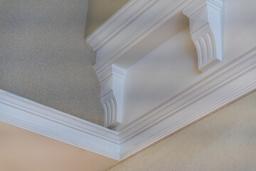 Ceiling moldings with an intricate crown in the inner corner. Home renovation, home decoration,...