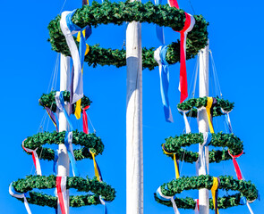 typical bavarian maypole with wreath