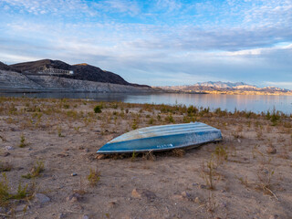 Sunken boat on dried up lake bed in Lake Mead