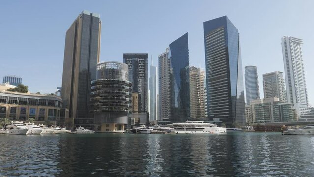 Yachts docked on the river in the luxurious part of Dubai.