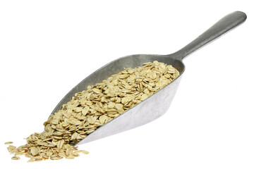 oatmeal in a weighing scoop isolated on white background