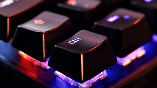 Keyboard key  - Control - macro shot.  Modern gaming keyboard close-up with beautiful color backlight.  Macro shooting of the rgb computer keyboard with backlight.  Low angle view with soft focus.