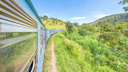 The Ella to Kandy diesel train locomotive winds through the Sri Lankan countryside