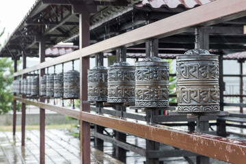 Religious prayer wheel for meditation in a Buddhist temple in Buryatia, Russia Ulan-Ude.