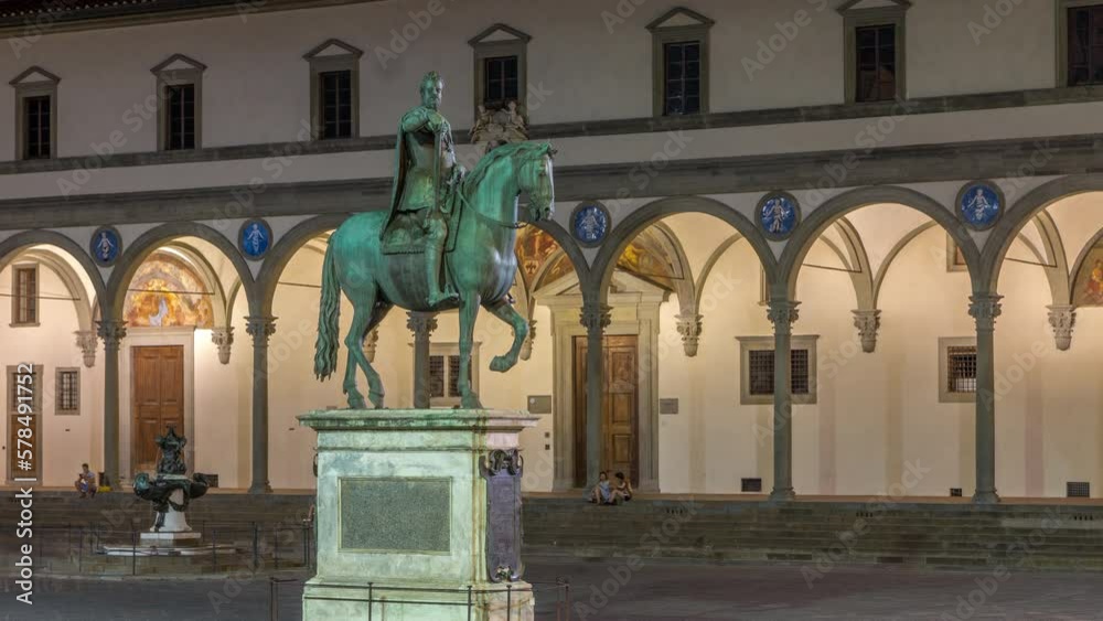 Wall mural Statue of Ferdinando I de Medici side view night timelapse, Grand Duke of Tuscany, located in the Piazza della Santissima Annunziata in Florence, Italy