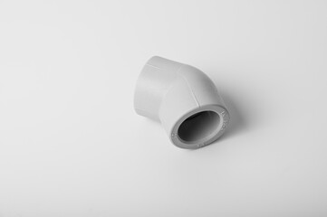 light gray PVC pipe tees for water, various types and diameters, isolated on a light background close-up. side view, top view