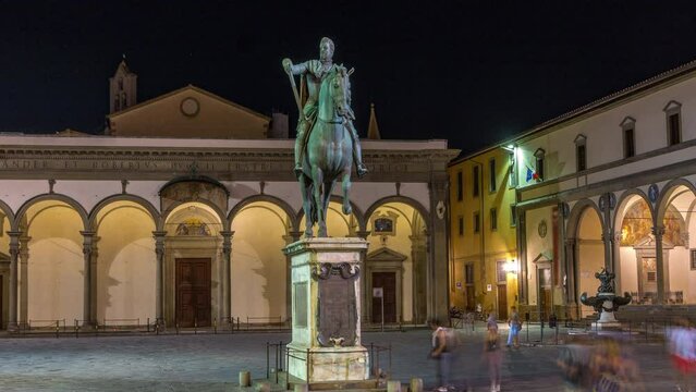 Statue of Ferdinando I de Medici front view night timelapse, Grand Duke of Tuscany, located in the Piazza della Santissima Annunziata in Florence, Italy