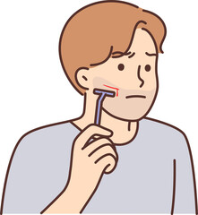 Man using manual razor cuts himself during morning skincare routine due to carelessness