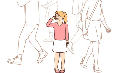 Little unhappy girl crying while standing on street in public place after getting lost in big city