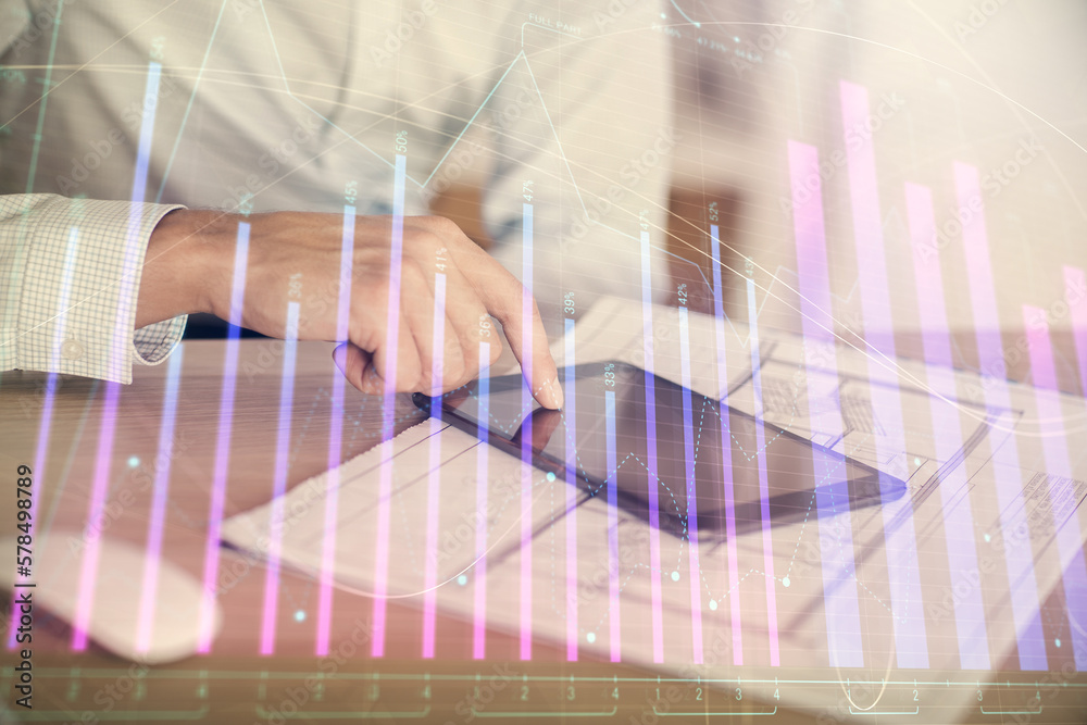 Poster double exposure of man's hands holding and using a digital device and forex graph drawing. financial