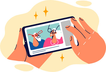 Phone with photo from blog elderly man and woman having fun and leading active lifestyle