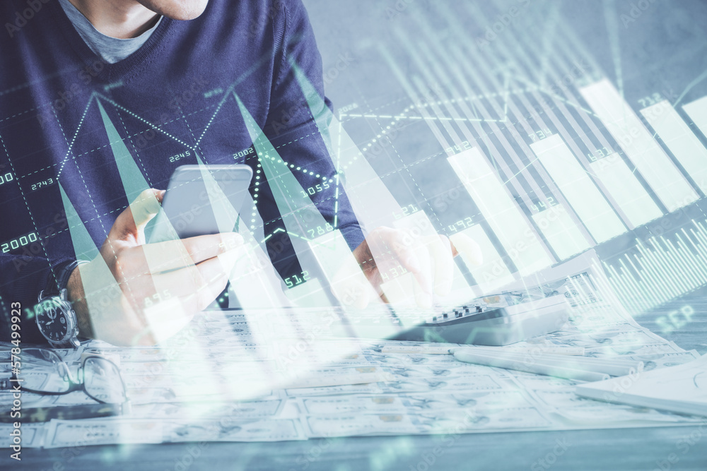 Poster double exposure of man's hands holding and using a digital device and forex graph drawing. financial