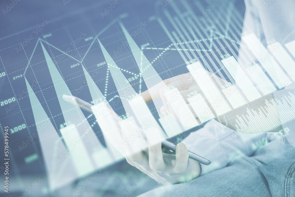 Poster double exposure of man's hands holding and using a digital device and forex graph drawing. financial