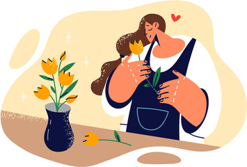 Woman in love smells flower given by guy on date and dreams of quick meeting or marriage