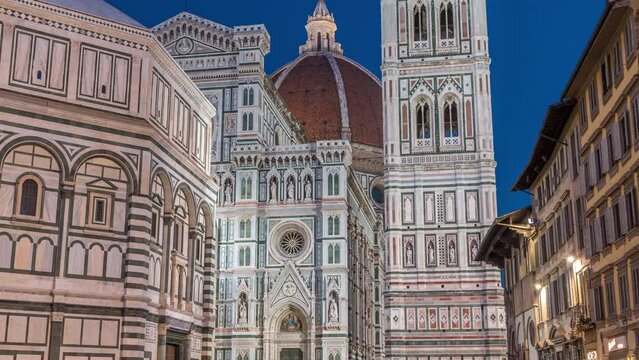 Facade and dome of The Basilica di Santa Maria del Fiore day to night timelapse which is the cathedral church (Duomo) of Florence in Italy. Evening illumination of bell tower