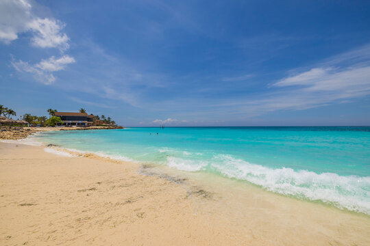 Gorgeous Nature Landscape View Of Turquoise Water Surface Merging With Blue Sky. Aruba. 