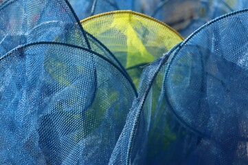 Background blue netting with a single yellow net 