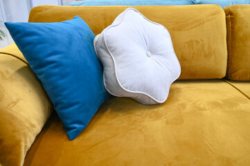 Soft colorful pillows close up. Sofa with colorful pillows in room