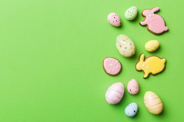 Happy Easter concept. Preparation for holiday. Easter eggs on colored background. flat lay top view copy space banner