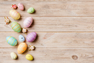 Fototapeta na wymiar Happy Easter concept. Preparation for holiday. Easter eggs on colored background. flat lay top view copy space banner