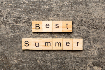 best Summer word written on wood block. best Summer text on cement table for your desing, concept