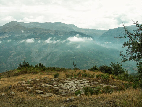 Scenic view of threshing floor with a mountain in the background