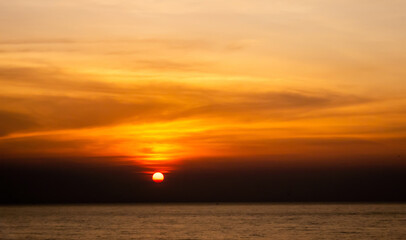 Background of sunset sky concept : sun in sunrise on sea, Morning time