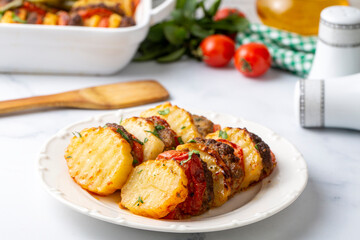 Traditional Turkish food; baked potatoes and meatballs. Turkish name; kofteli patates dizmesi, patates dizme