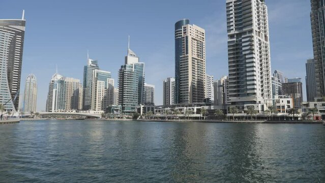 A riverside of the modern city with the futuristic architecture.