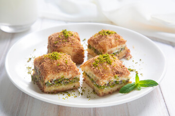 Traditional turkish new dessert cold milky baklava with pistachio (Turkish name; soguk baklava)