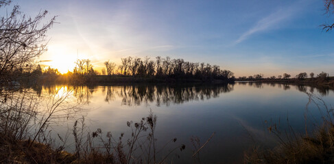 Fototapeta na wymiar Panoramic view of river bend at sunrise 