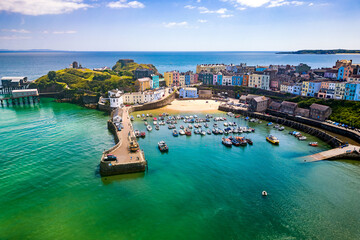 Aerial view of colourful buildings around a small harbour (Tenby, Wales)