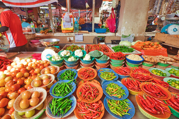 Naklejka premium Chow Kit Road Market in Kuala Lumpur city of Malaysia. Stalls selling their goods here for generations, and are experts in selecting and presenting their produce in an appealing way.