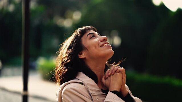 Faithful woman hands feeling gratitude. Successful girl thanking God