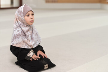 Young Muslim Girl Is Praying In The Mosque