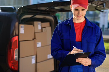 Courier with clipboard near delivery van outdoors, space for text