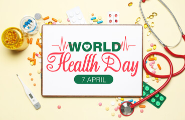 Clipboard with stethoscope and pills on light yellow background. World Health Day