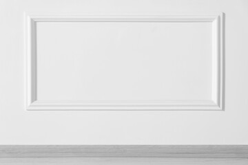 Beautiful white wall with molding in clean empty room