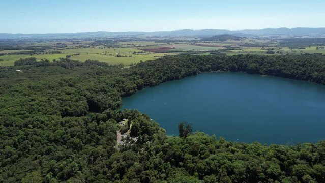 Spectacular aerial footage of Lake Eacham Atherton Tablelands Queensland Australia
