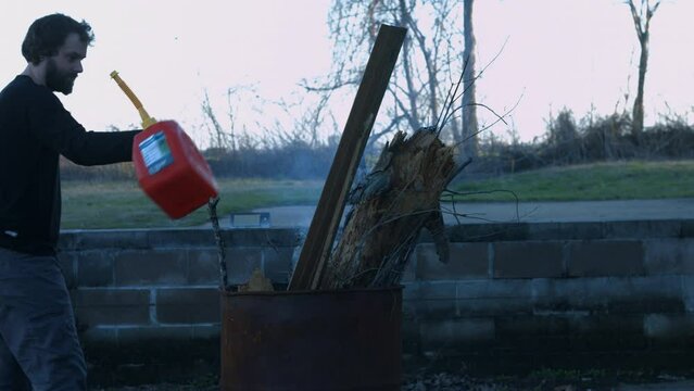 Young Person Tending Trash Can Fire in Rural Tennessee USA BMPC4K